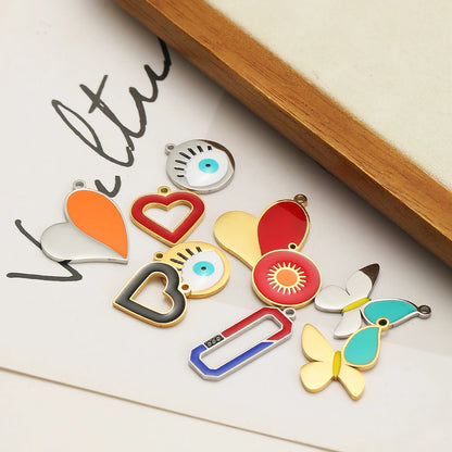 European American Style Stainless Steel Gold Plated Enamel Heart Eye Butterfly Charm Pendant for Jewelry Necklace Making